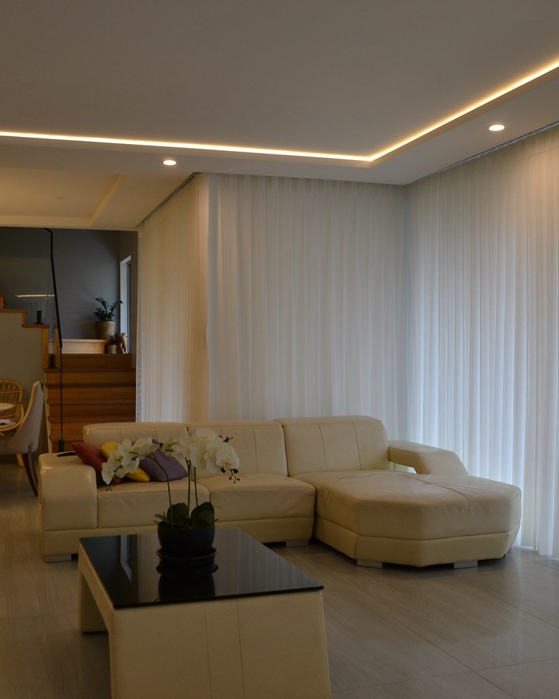 A sunlit Perth living room dressed in sheer curtains